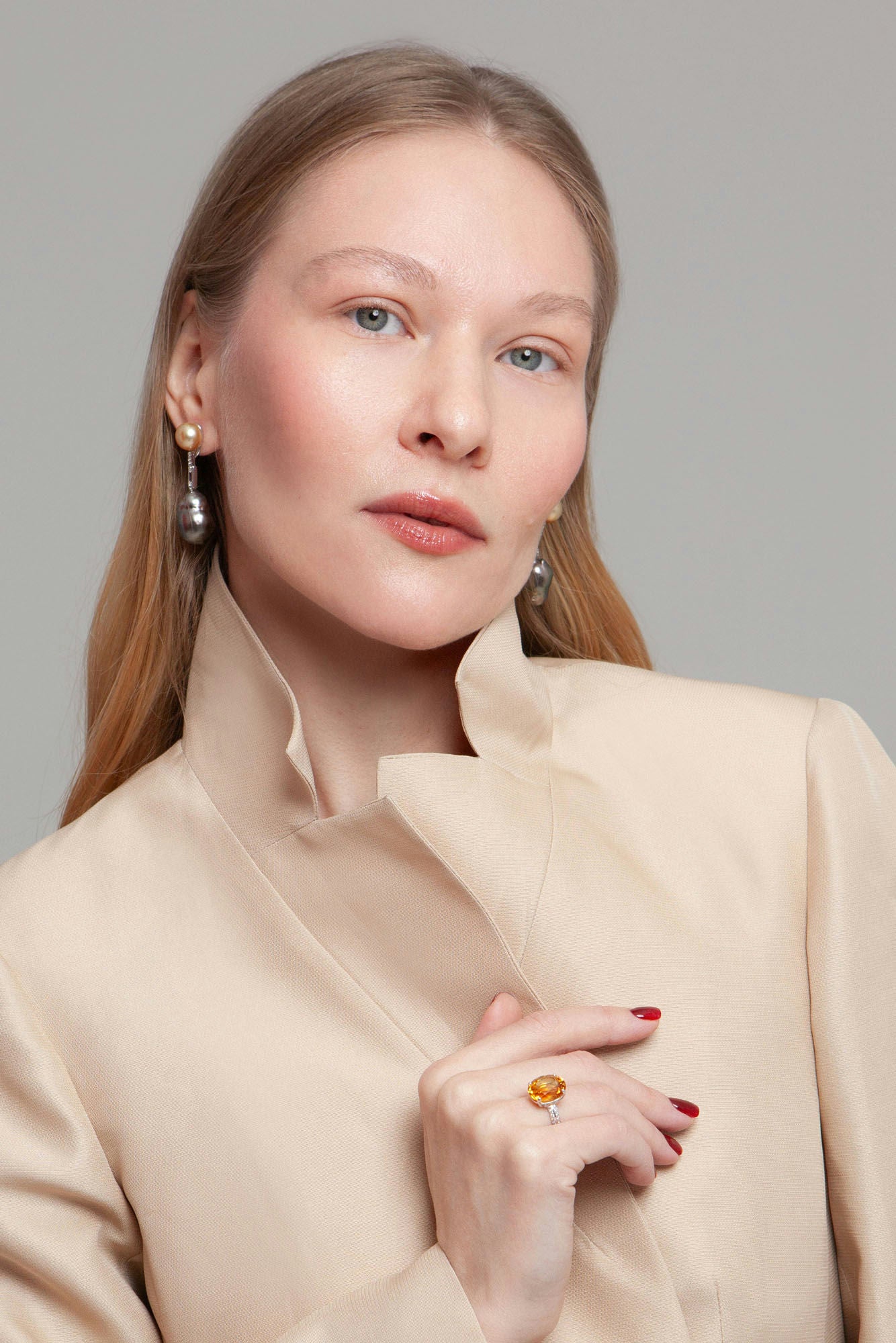 Earrings in 18K white gold featuring 10 mm South Sea pearls, 15 mm black baroque pearls, and 10 diamonds totaling 0.21 ct.