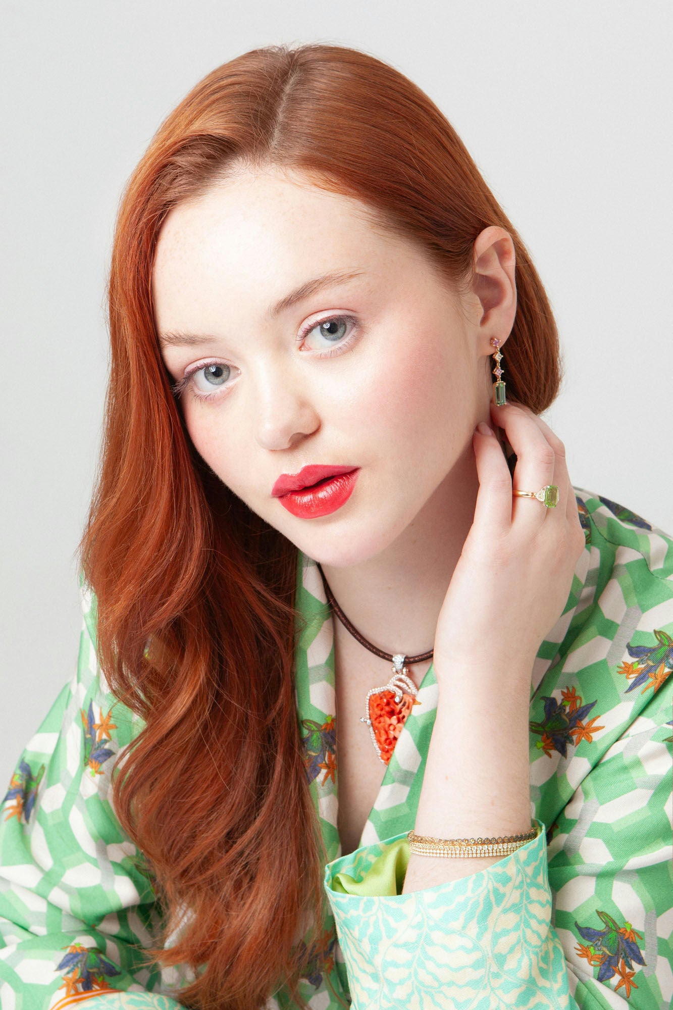 18K yellow gold line bracelet featuring 51 natural multicolour sapphires totaling approximately 5.60 carats.