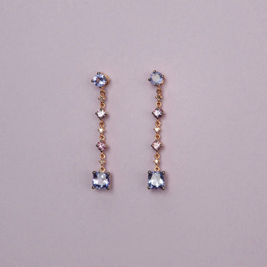 Drop earrings in 18K rose gold featuring 2.833 ct total weight of blue and pink sapphires, and round-cut diamonds.