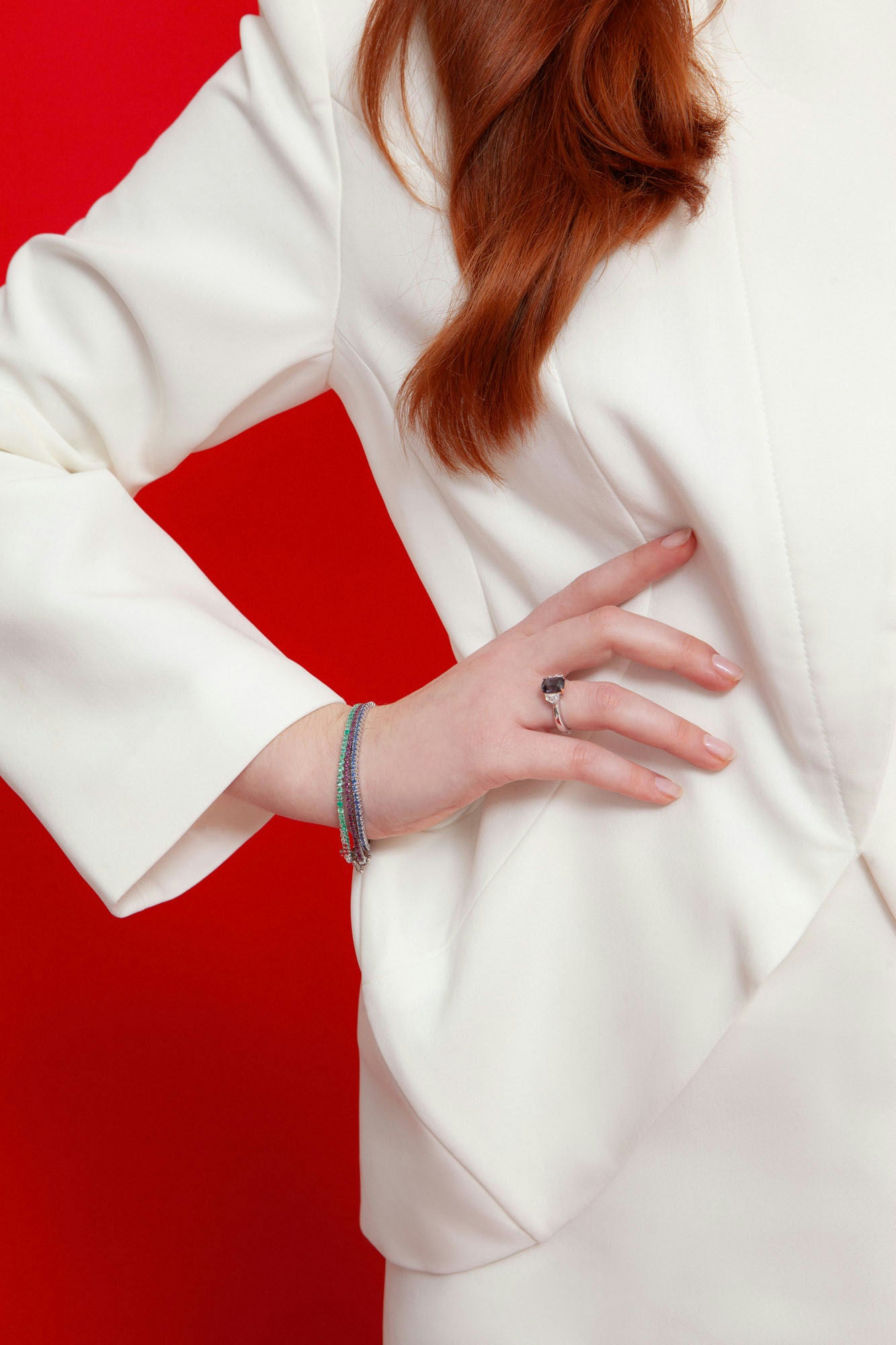 18K white gold bangle bracelet featuring 69 natural rhodolites totaling approximately 2.55 carats with raspberry hue.