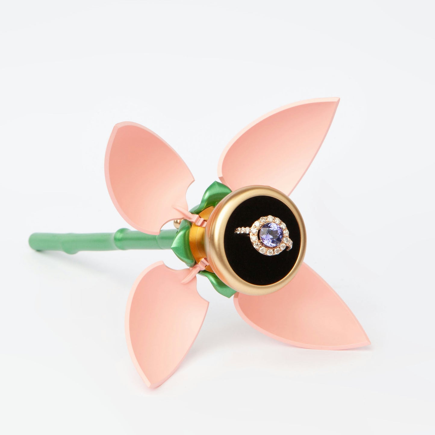 18K rose gold ring featuring 2.55 ct natural tanzanite and 24 natural diamonds totaling 1.211 ct.