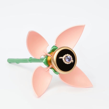 18K rose gold ring featuring 2.55 ct natural tanzanite and 24 natural diamonds totaling 1.211 ct.