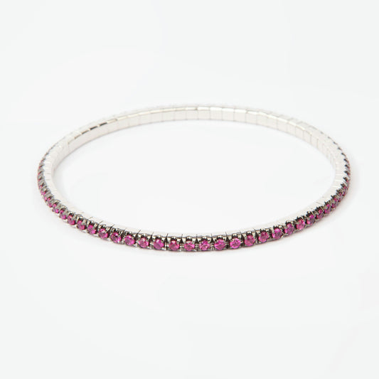 18K white gold bangle bracelet featuring 69 natural rhodolites totaling approximately 2.55 carats with raspberry hue.