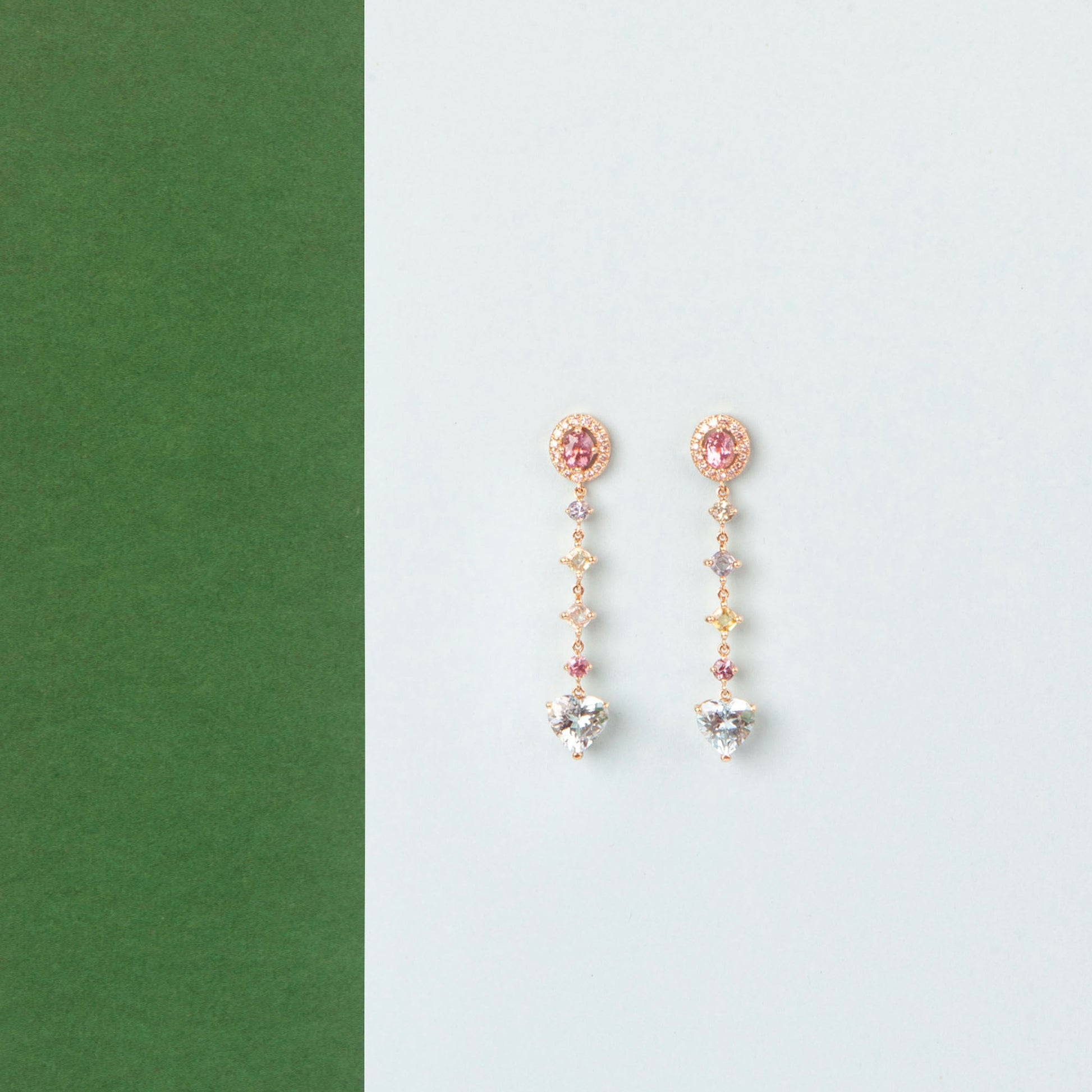 18K Yellow Gold ring featuring 2.895 ct heart-shaped aquamarines and 5.358 ct of pink and colored sapphires.