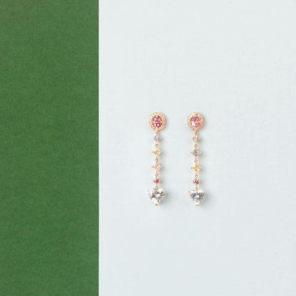 18K Yellow Gold ring featuring 2.895 ct heart-shaped aquamarines and 5.358 ct of pink and colored sapphires.