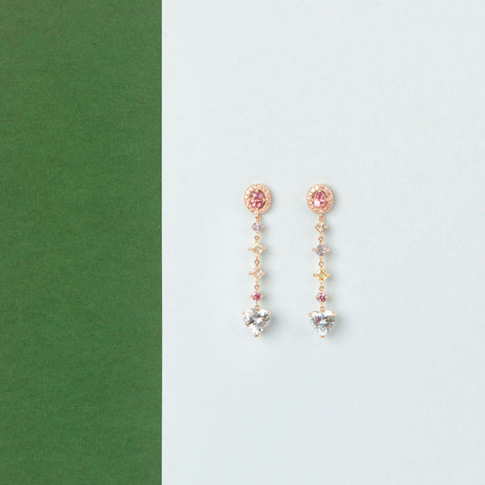 18K Yellow Gold ring featuring 2.895 ct heart-shaped aquamarines and 5.358 ct of pink and colored sapphires.