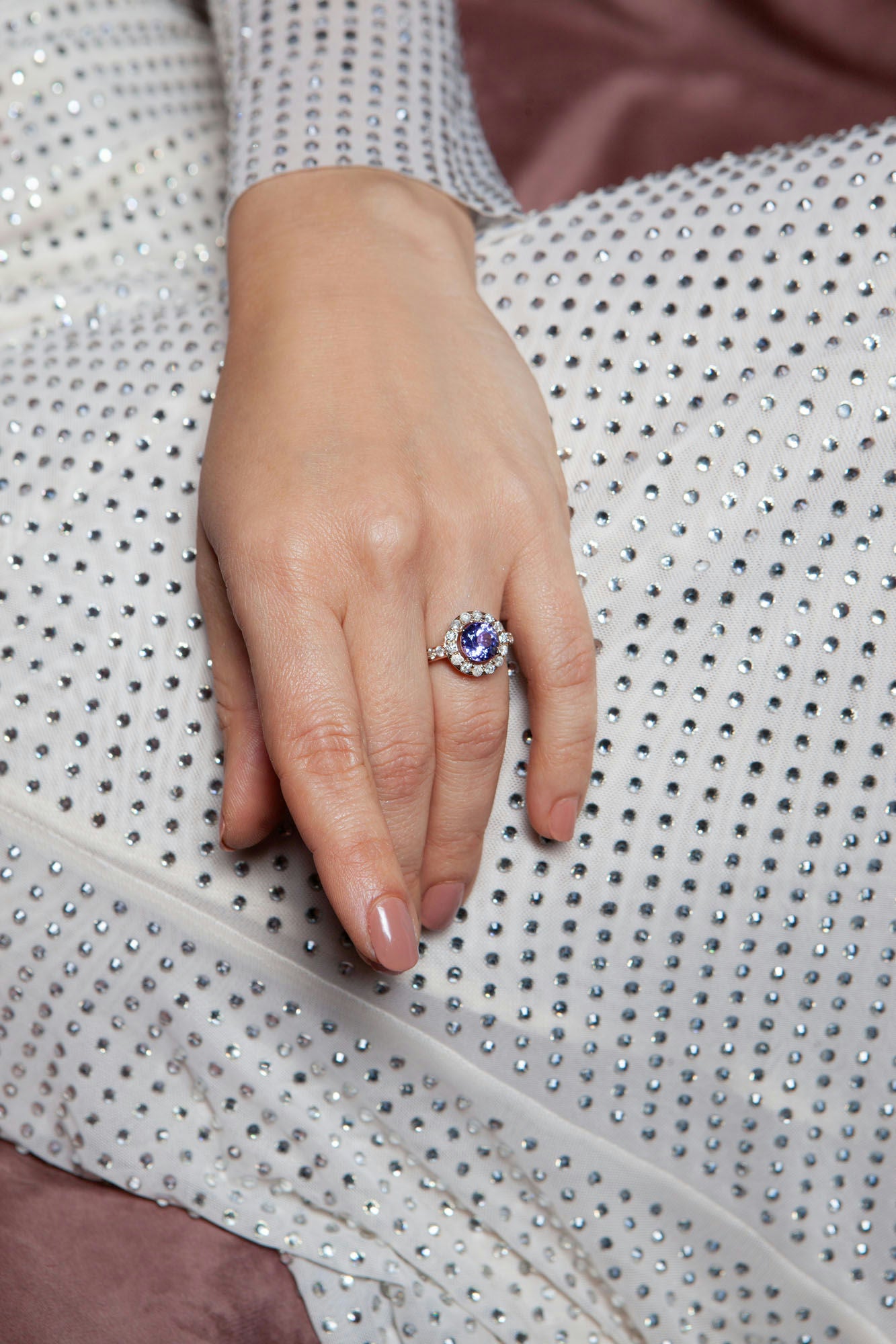 18K rose gold ring featuring 2.55 ct natural tanzanite and 24 natural diamonds totaling 1.211 ct.