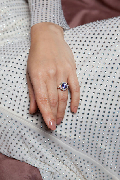 18K rose gold ring featuring 2.55 ct natural tanzanite and 24 natural diamonds totaling 1.211 ct.