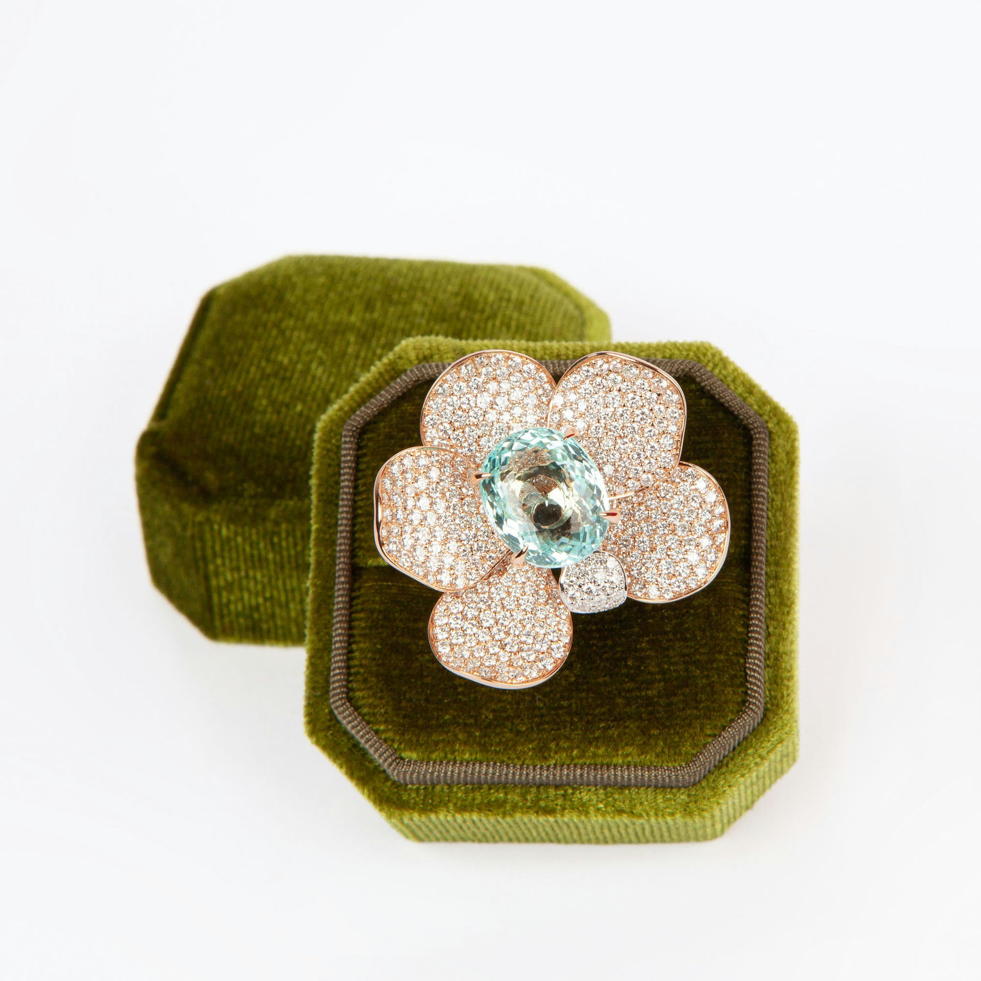 Statement ring in 18K rose gold featuring 9.2 ct GIA-certified green Paraiba tourmaline and 4.00 ct natural diamonds.