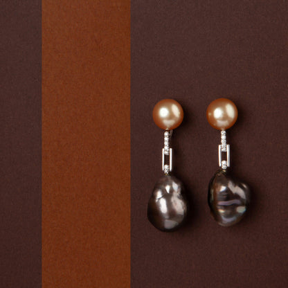 Earrings in 18K white gold featuring 10 mm South Sea pearls, 15 mm black baroque pearls, and 10 diamonds totaling 0.21 ct.