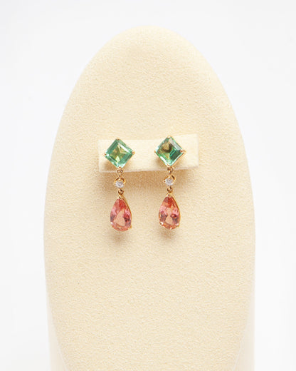 NOVI Jewelry 18k yellow gold earrings with 3.35 ct square green tourmalines, 4.31 ct pear-shaped orangy-pink tourmalines, and 0.14 ct VS diamonds, total jewelry weight 5.8 g, gold weight 4.2 g, vibrant gemstone earrings.