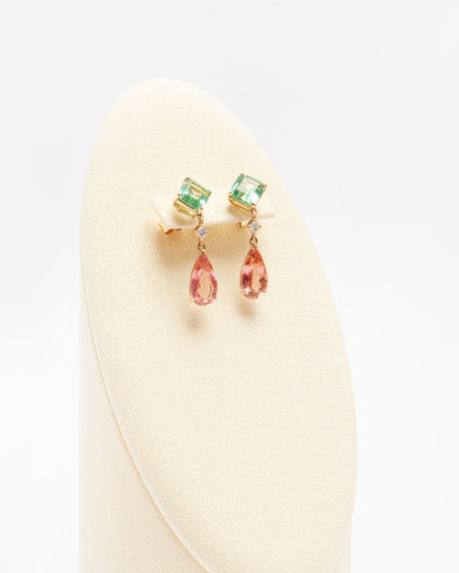 NOVI Jewelry 18k yellow gold earrings with 3.35 ct square green tourmalines, 4.31 ct pear-shaped orangy-pink tourmalines, and 0.14 ct VS diamonds, total jewelry weight 5.8 g, gold weight 4.2 g, vibrant gemstone earrings.
