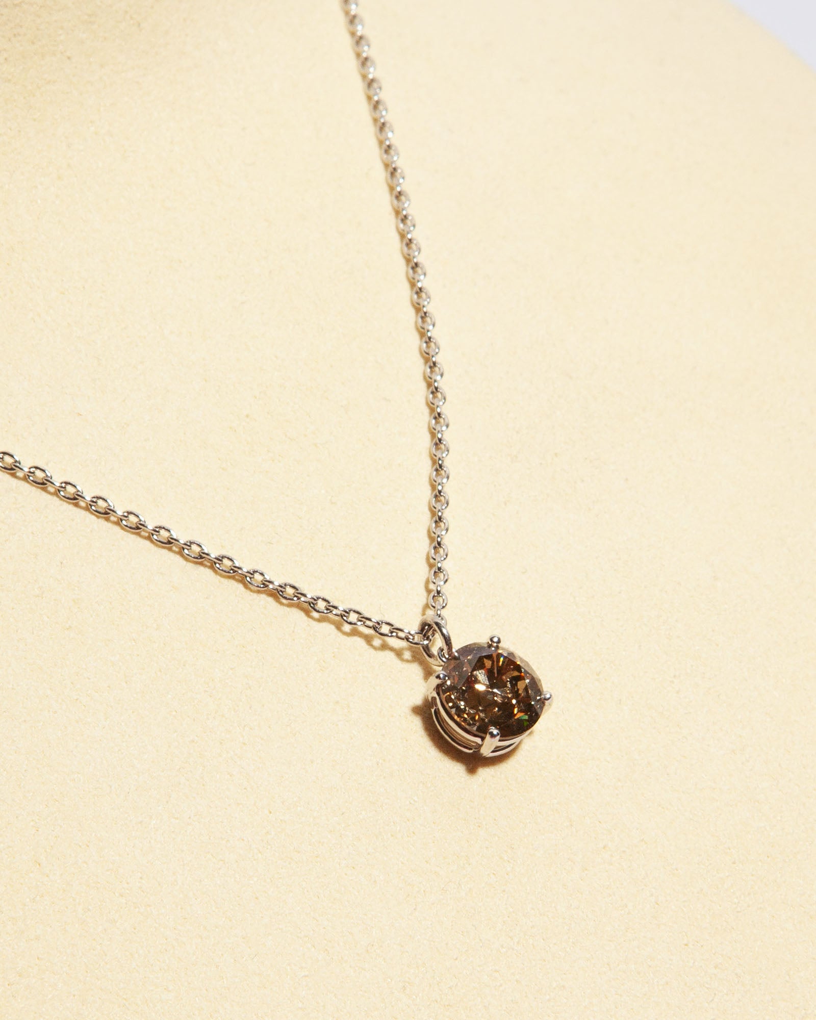 NOVI Jewelry 18K gold pendant necklace with 1.51 ct fancy yellow-brown natural diamond, I1, IGI certified luxury diamond jewelry.