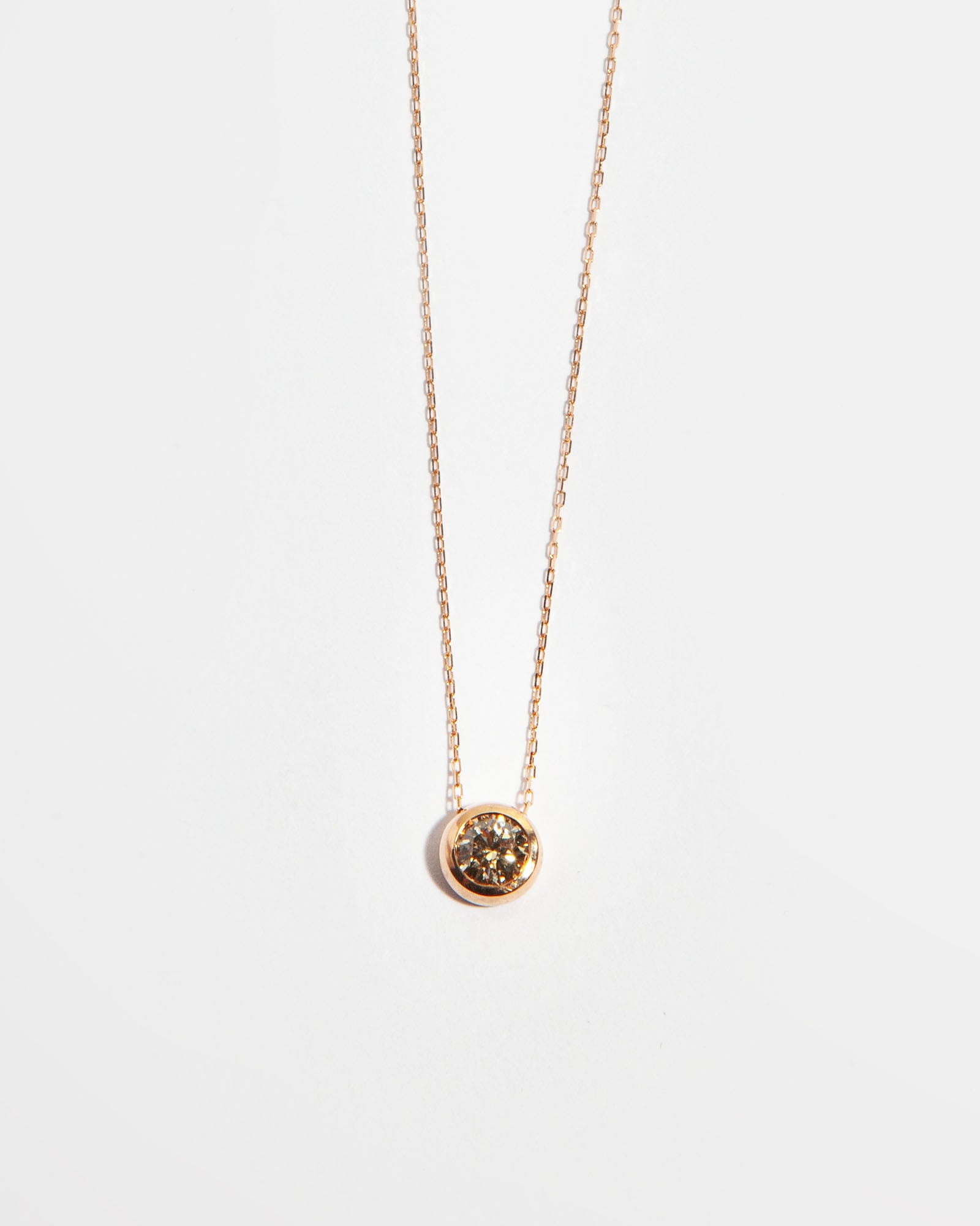 NOVI Jewelry 18K gold pendant necklace with 0.33 ct fancy intense brown natural diamond, IGI certified elegant diamond jewelry.