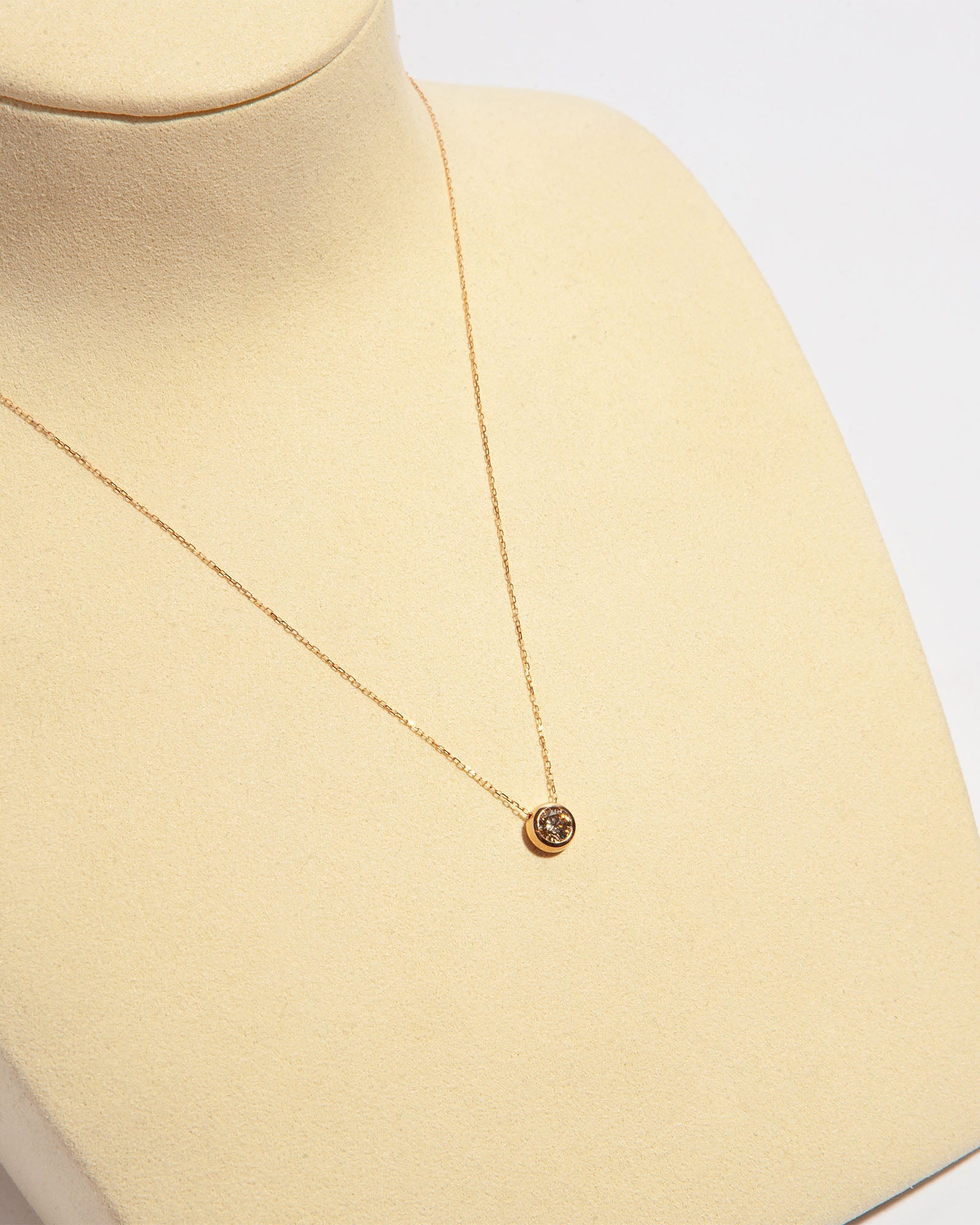 NOVI Jewelry 18K gold pendant necklace with 0.33 ct fancy intense brown natural diamond, IGI certified elegant diamond jewelry.