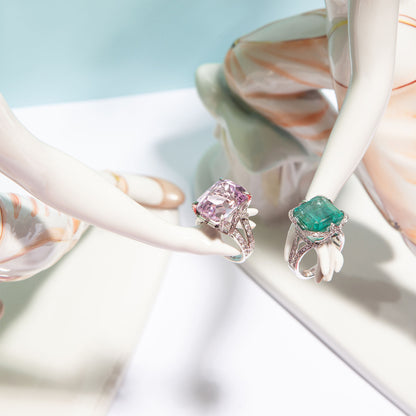 NOVI Jewelry 14K white gold ring featuring a 9.80 ct bluish-green emerald accented with 0.79 ct Faint Pink SI1/E diamonds, IGI certified, elegant and timeless design highlighting the emerald’s color and diamond sparkle.