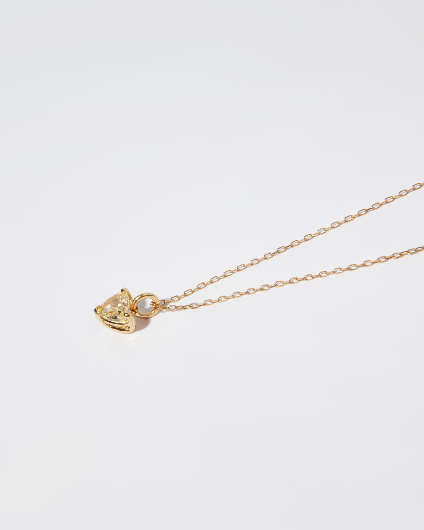 NOVI Jewelry 18K gold heart-shaped pendant with 0.42 ct fancy intense brownish-yellow natural diamond, IGI certified romantic diamond jewelry.