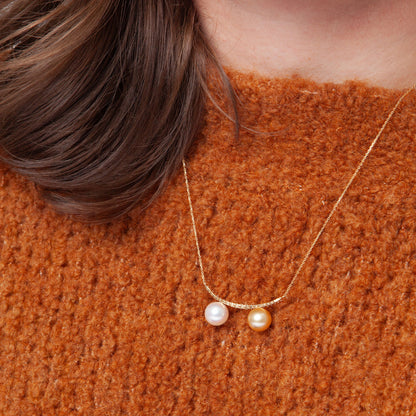 NOVI Jewelry 18K gold necklace with two 9 mm pearls and 0.30 ct natural diamonds, elegant dual-pearl luxury pendant.