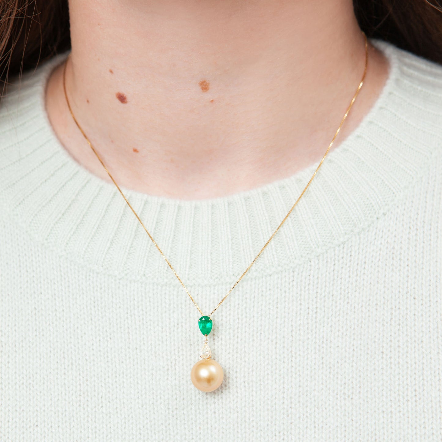NOVI Jewelry 18K gold necklace with 12.5 mm Golden Pearl, 0.80 ct emerald and 0.383 ct natural diamond, CGL certified luxury gemstone pendant.