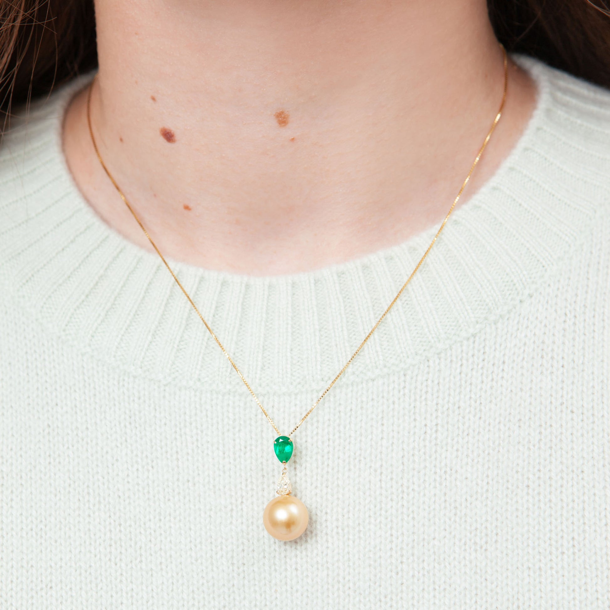 NOVI Jewelry 18K gold necklace with 12.5 mm Golden Pearl, 0.80 ct emerald and 0.383 ct natural diamond, CGL certified luxury gemstone pendant.
