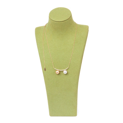 NOVI Jewelry 18K gold necklace with two 9 mm pearls and 0.30 ct natural diamonds, elegant dual-pearl luxury pendant.