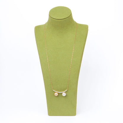 NOVI Jewelry 18K gold necklace with two 9 mm pearls and 0.30 ct natural diamonds, elegant dual-pearl luxury pendant.