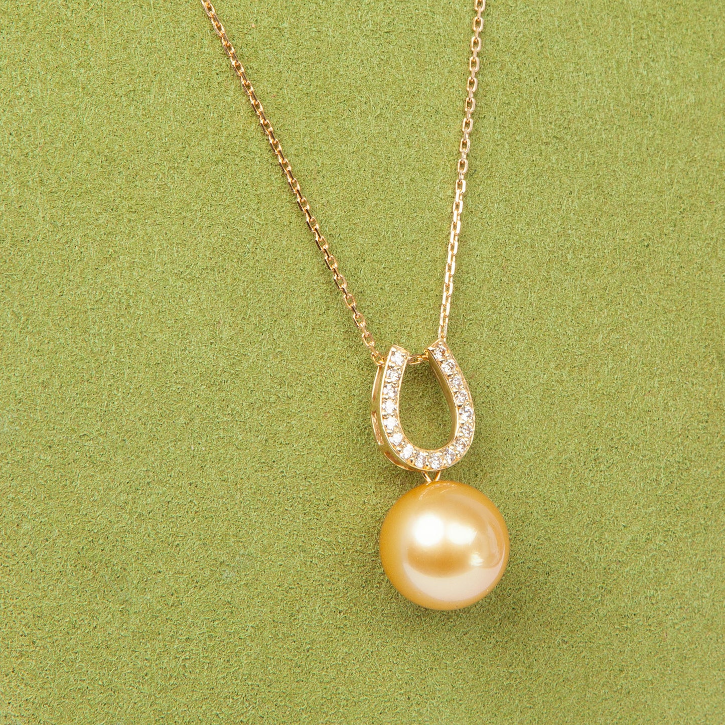 NOVI Jewelry 18K gold pendant with 12.6 mm golden South Sea pearl and 0.20 ct natural diamonds, luxury fine jewelry.