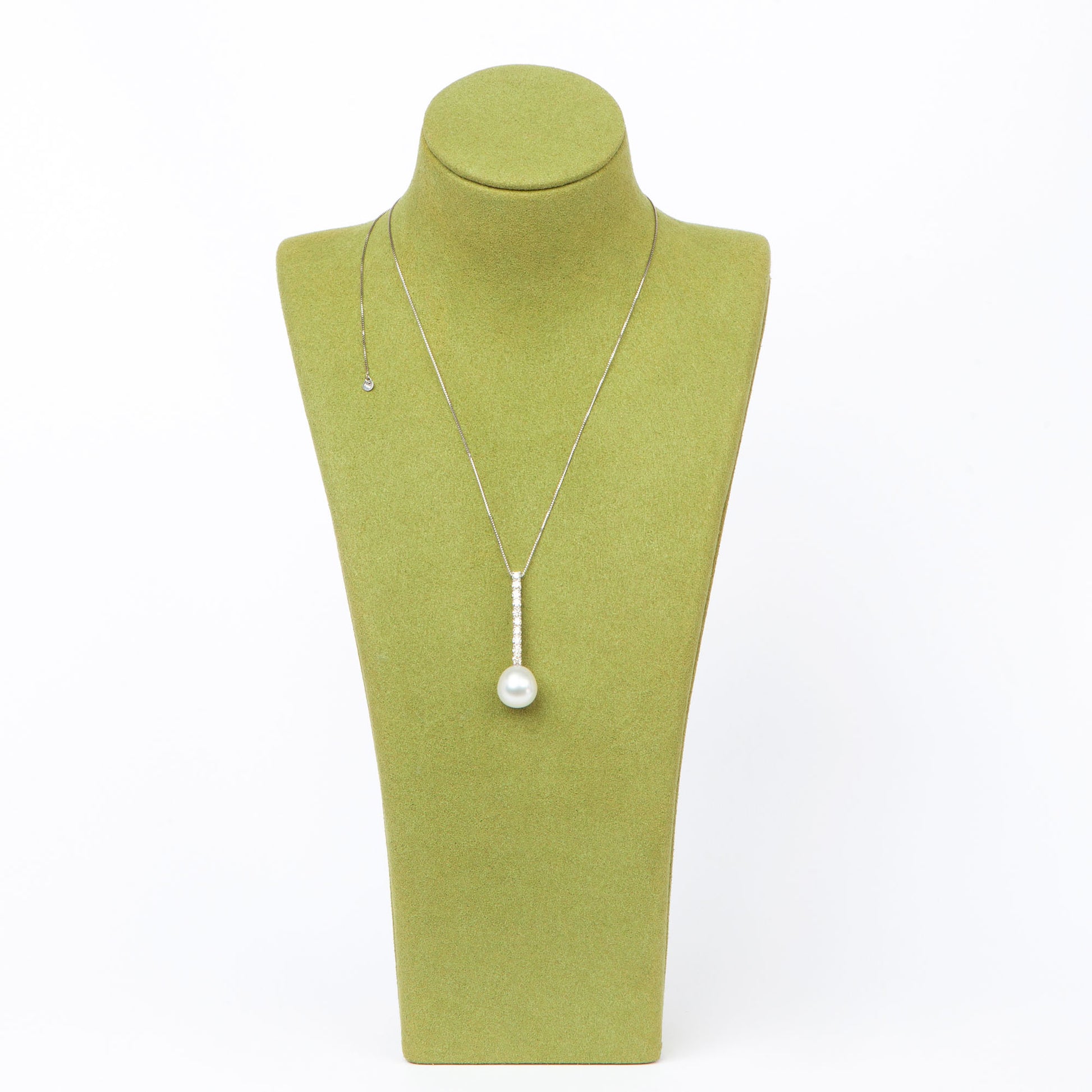 NOVI Jewelry floral-inspired pendant with blue-toned gemstones, elegant luxury gemstone flower design.