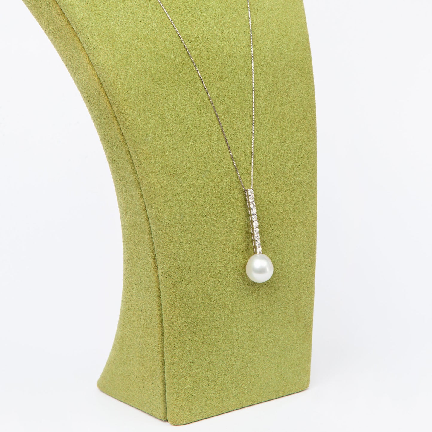 NOVI Jewelry floral-inspired pendant with blue-toned gemstones, elegant luxury gemstone flower design.