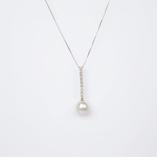 NOVI Jewelry floral-inspired pendant with blue-toned gemstones, elegant luxury gemstone flower design.