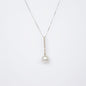 NOVI Jewelry floral-inspired pendant with blue-toned gemstones, elegant luxury gemstone flower design.