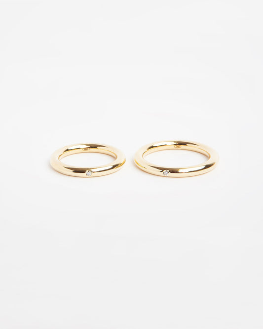 NOVI Jewelry 18K yellow gold wedding rings with 0.015 ct natural diamonds, elegant matching diamond ring pair.