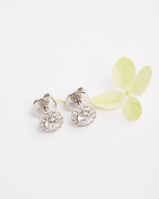 NOVI Jewelry halo stud earrings with 0.60 ct D/E color natural diamonds, IF/VVS2, IGI certified, jewelry weight 3.4 g, gold weight 3.3 g, round brilliant cut diamond earrings.