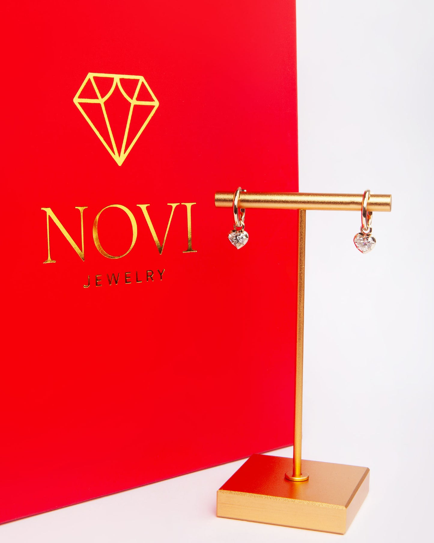 NOVI Jewelry 18K rose gold earrings with 1.01 ct heart-cut natural diamonds, GIA certified luxury diamond earrings.