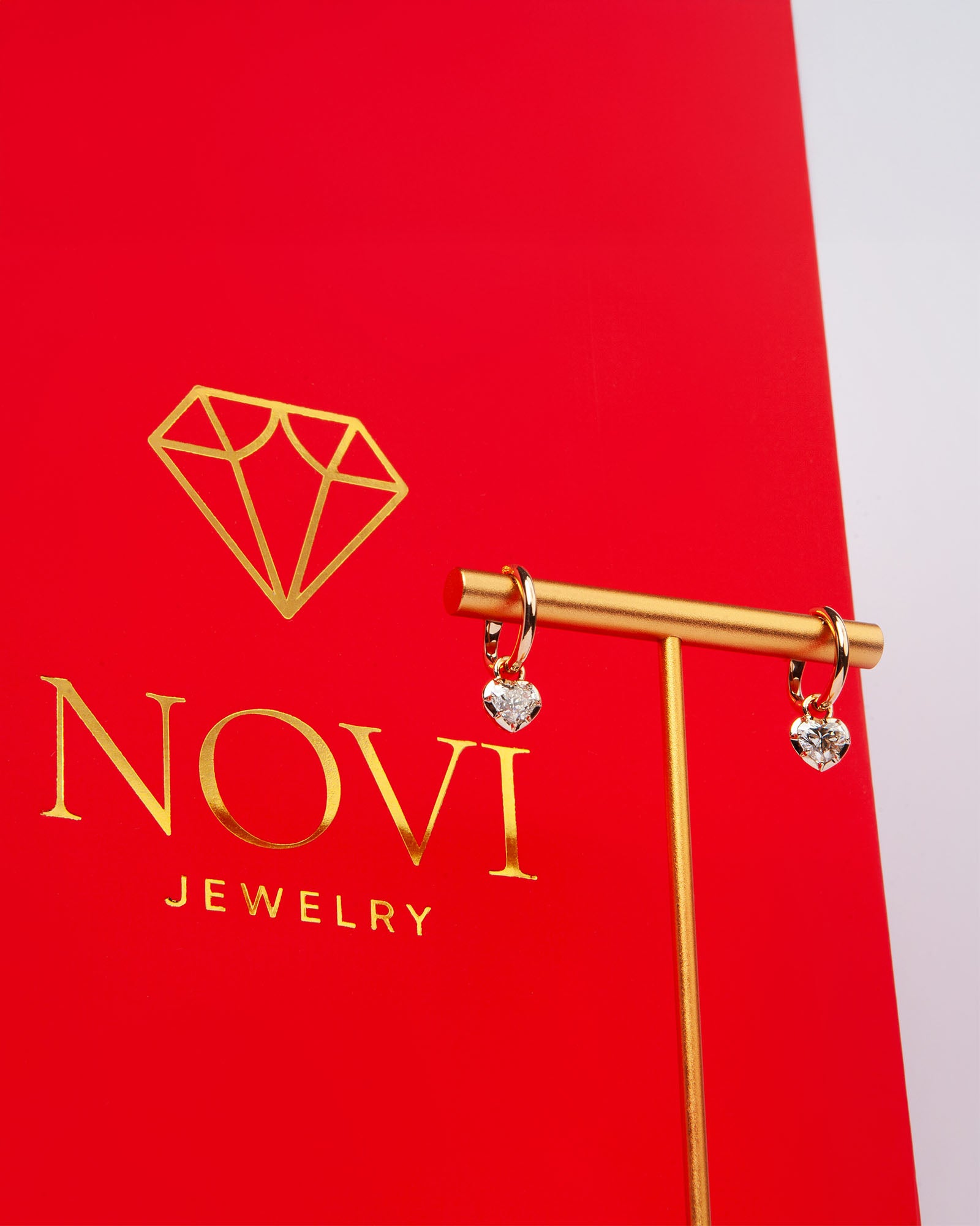 NOVI Jewelry 18K rose gold earrings with 1.01 ct heart-cut natural diamonds, GIA certified luxury diamond earrings.