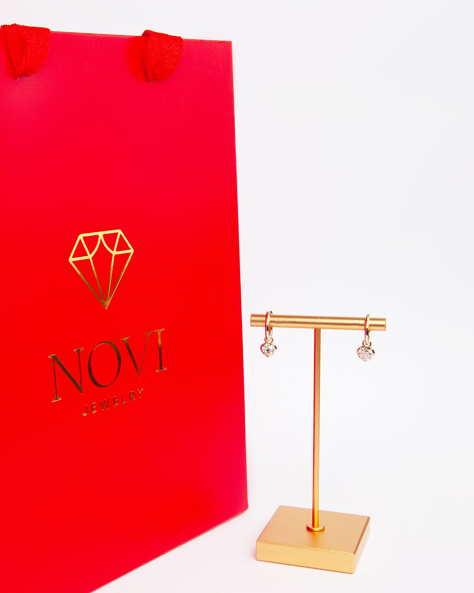 NOVI Jewelry 18K rose gold earrings with 1.01 ct heart-cut natural diamonds, GIA certified luxury diamond earrings.