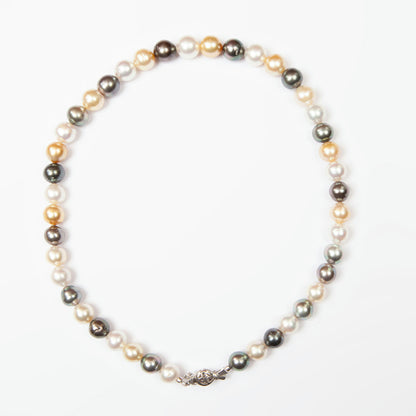 Elegant necklace featuring 43 natural South Sea pearls in white, golden, and dark tones.
