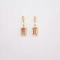 Earrings in 18K gold featuring 8.8 × 4.2 mm tourmalines and 54 natural diamonds totaling 0.617 ct.