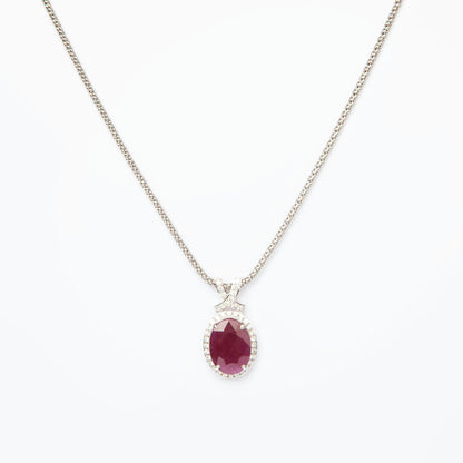 14-karat white gold pendant featuring a 6.75ct natural ruby and 40 diamonds totaling 0.51ct, certified by IGI.