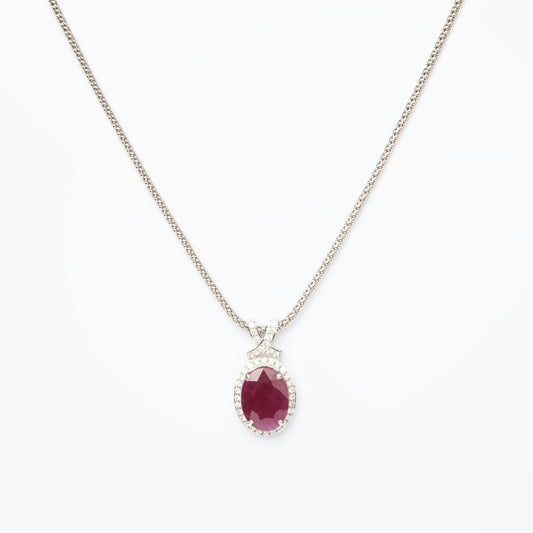 14-karat white gold pendant featuring a 6.75ct natural ruby and 40 diamonds totaling 0.51ct, certified by IGI.