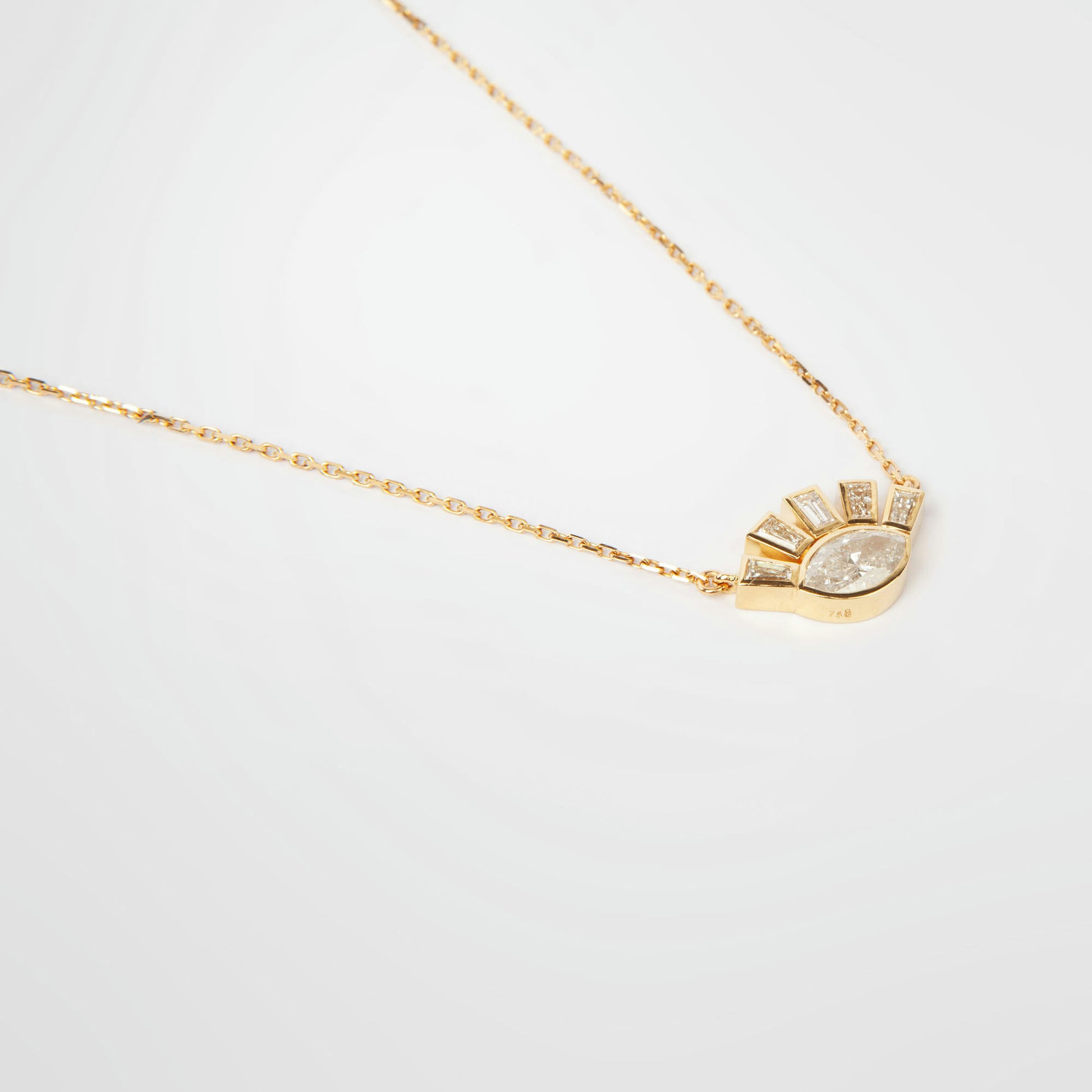 18K white gold necklace featuring 1.01 ct marquise diamond and 0.62 ct trapezoid-cut diamonds, IGI and IGE certified.