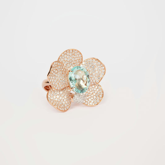 Statement ring in 18K rose gold featuring 9.2 ct GIA-certified green Paraiba tourmaline and 4.00 ct natural diamonds.