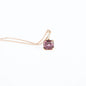 Pendant in gold featuring a natural purple spinel (1.98 ct) and four diamonds (0.04 ct) in an emerald step cut.