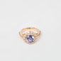 18K rose gold ring featuring 2.55 ct natural tanzanite and 24 natural diamonds totaling 1.211 ct.