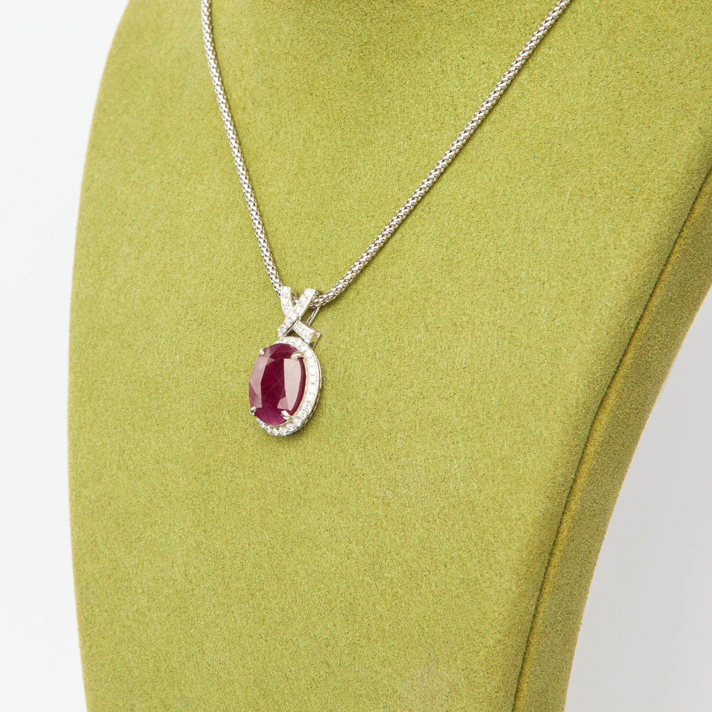 14-karat white gold pendant featuring a 6.75ct natural ruby and 40 diamonds totaling 0.51ct, certified by IGI.