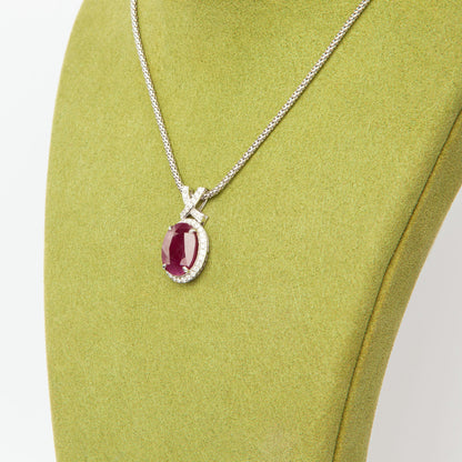 14-karat white gold pendant featuring a 6.75ct natural ruby and 40 diamonds totaling 0.51ct, certified by IGI.