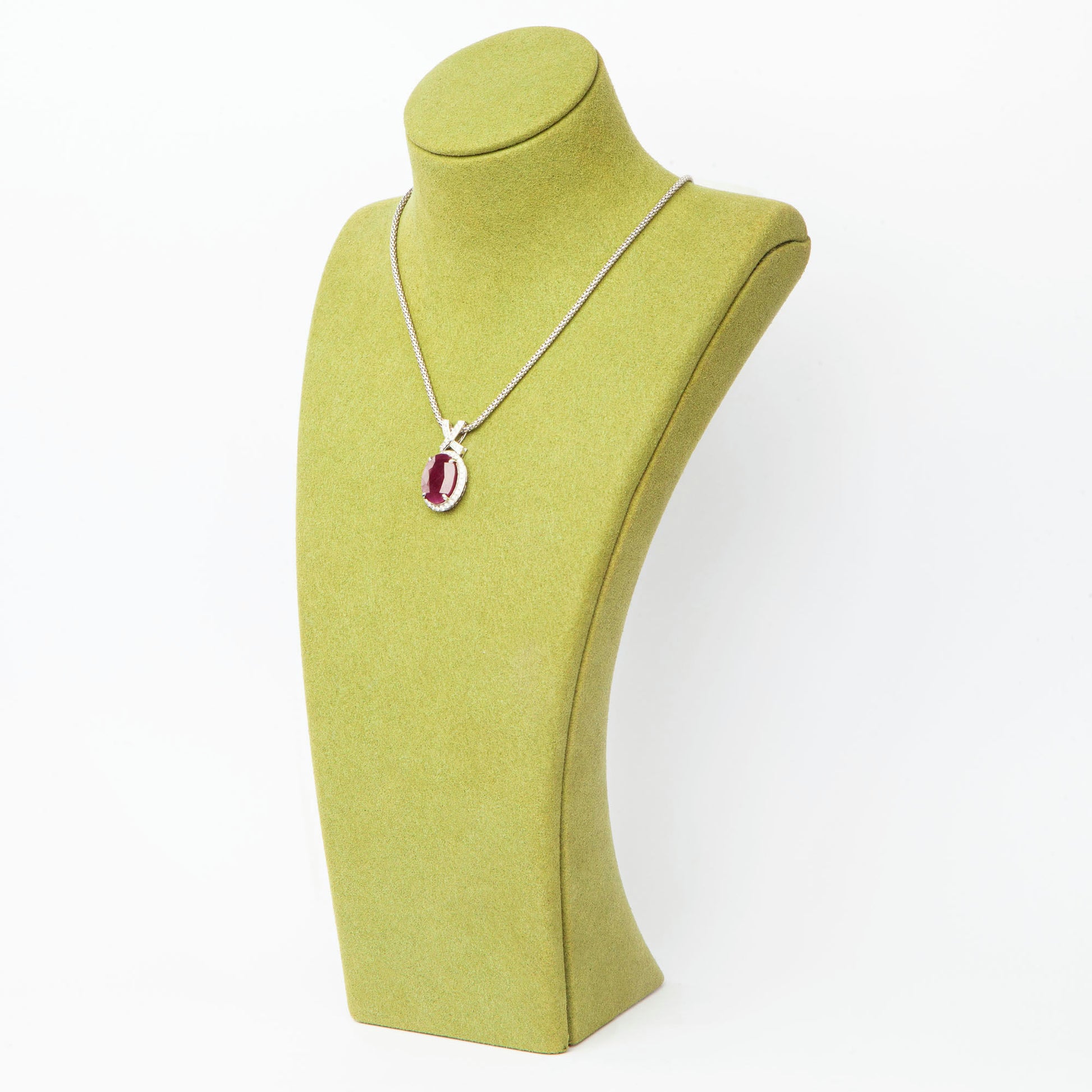 14-karat white gold pendant featuring a 6.75ct natural ruby and 40 diamonds totaling 0.51ct, certified by IGI.