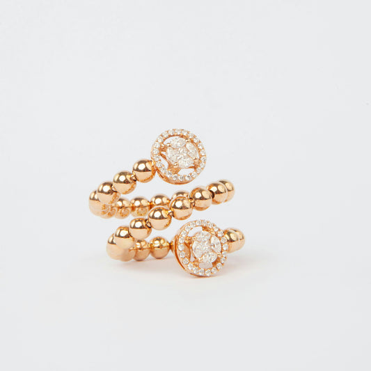 18K pink gold ring featuring 0.74 ct natural diamonds and a spiral design with two circular diamond halos.