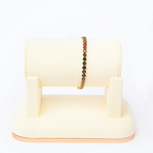 18K yellow gold line bracelet featuring 51 natural multicolour sapphires totaling approximately 5.60 carats.