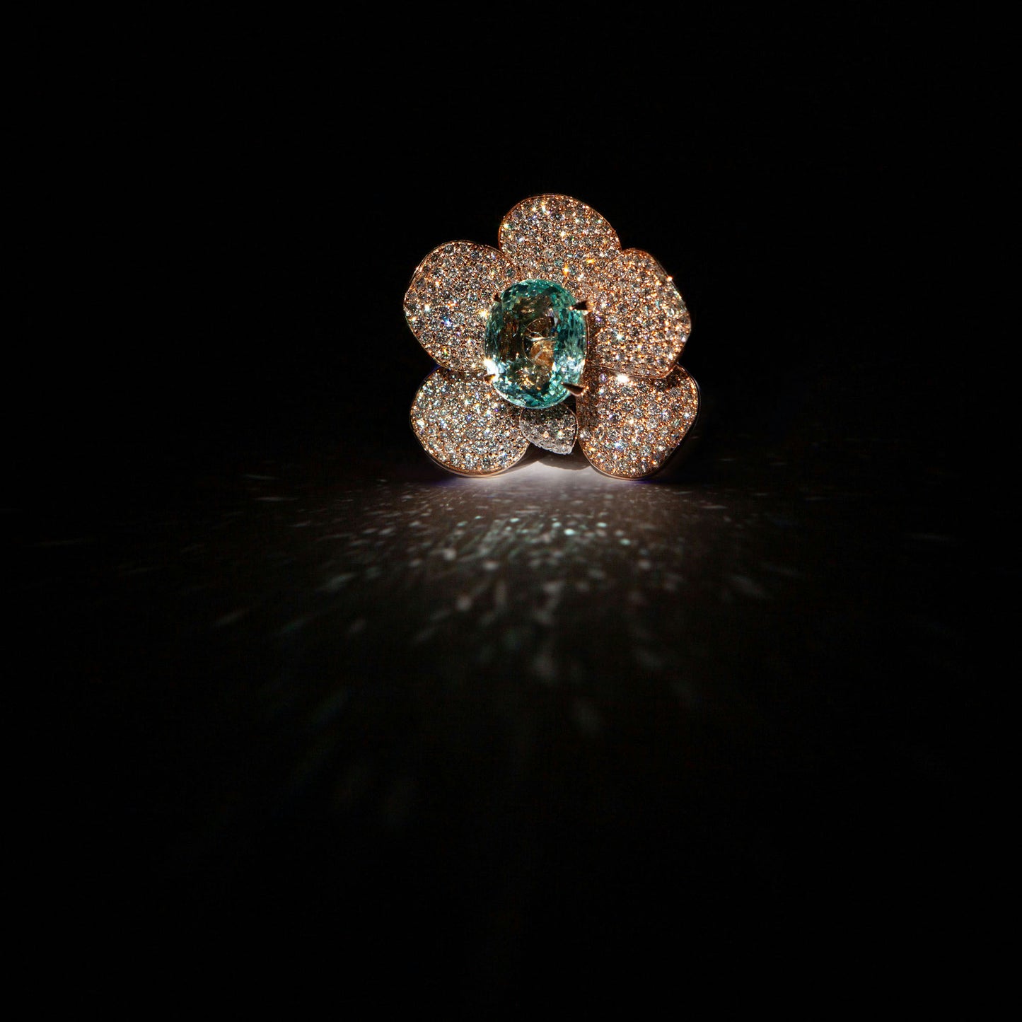 Statement ring in 18K rose gold featuring 9.2 ct GIA-certified green Paraiba tourmaline and 4.00 ct natural diamonds.